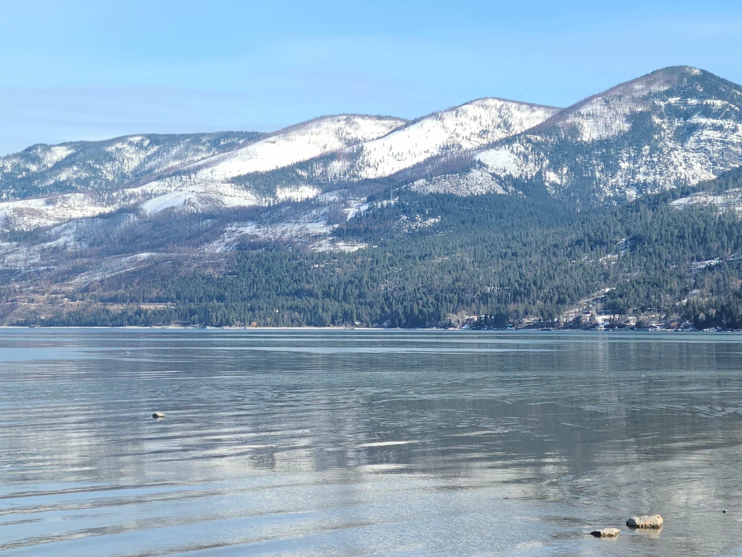 Snowed mountains and lake.